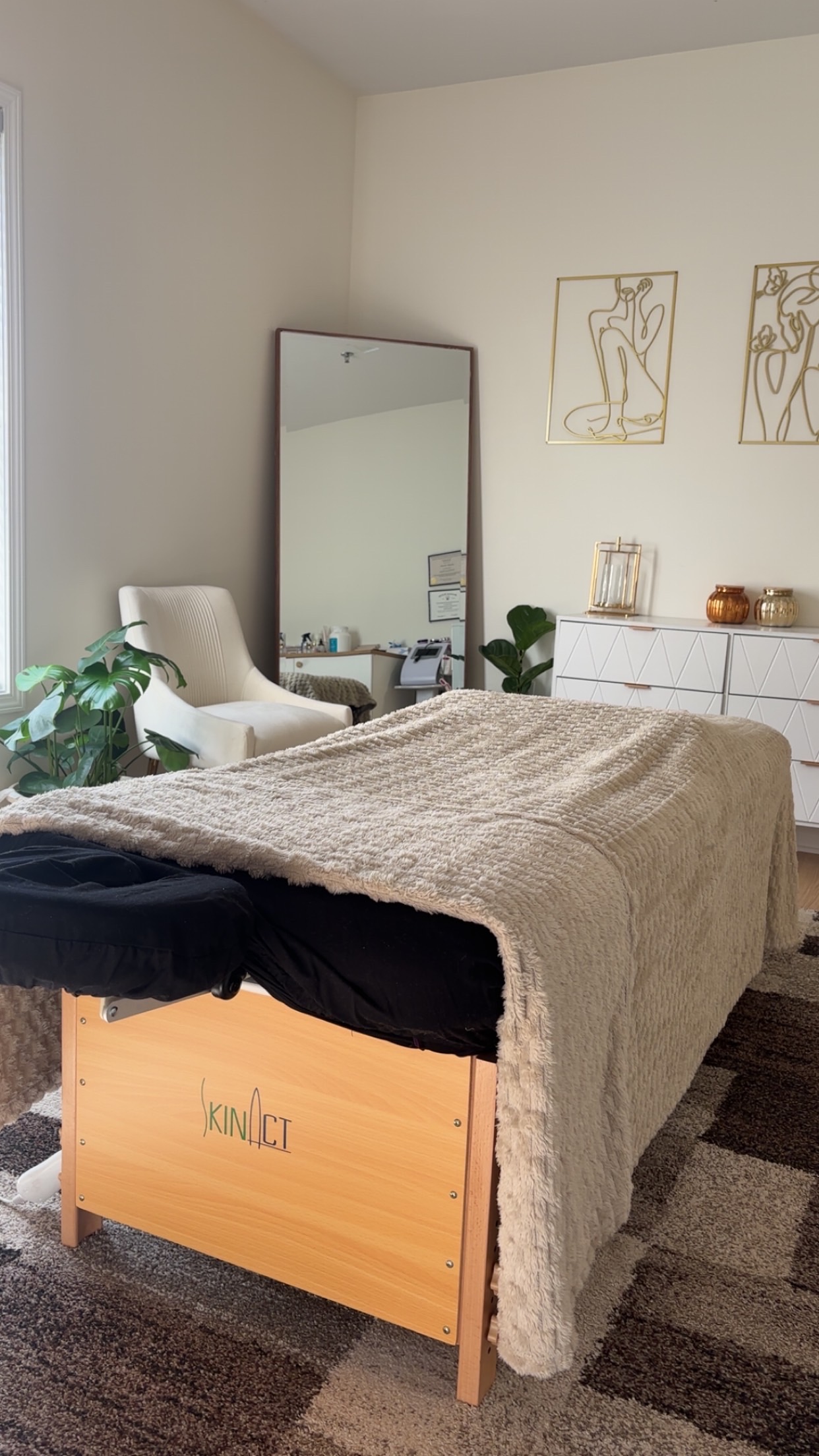 Peaceful massage therapy room with professional setup